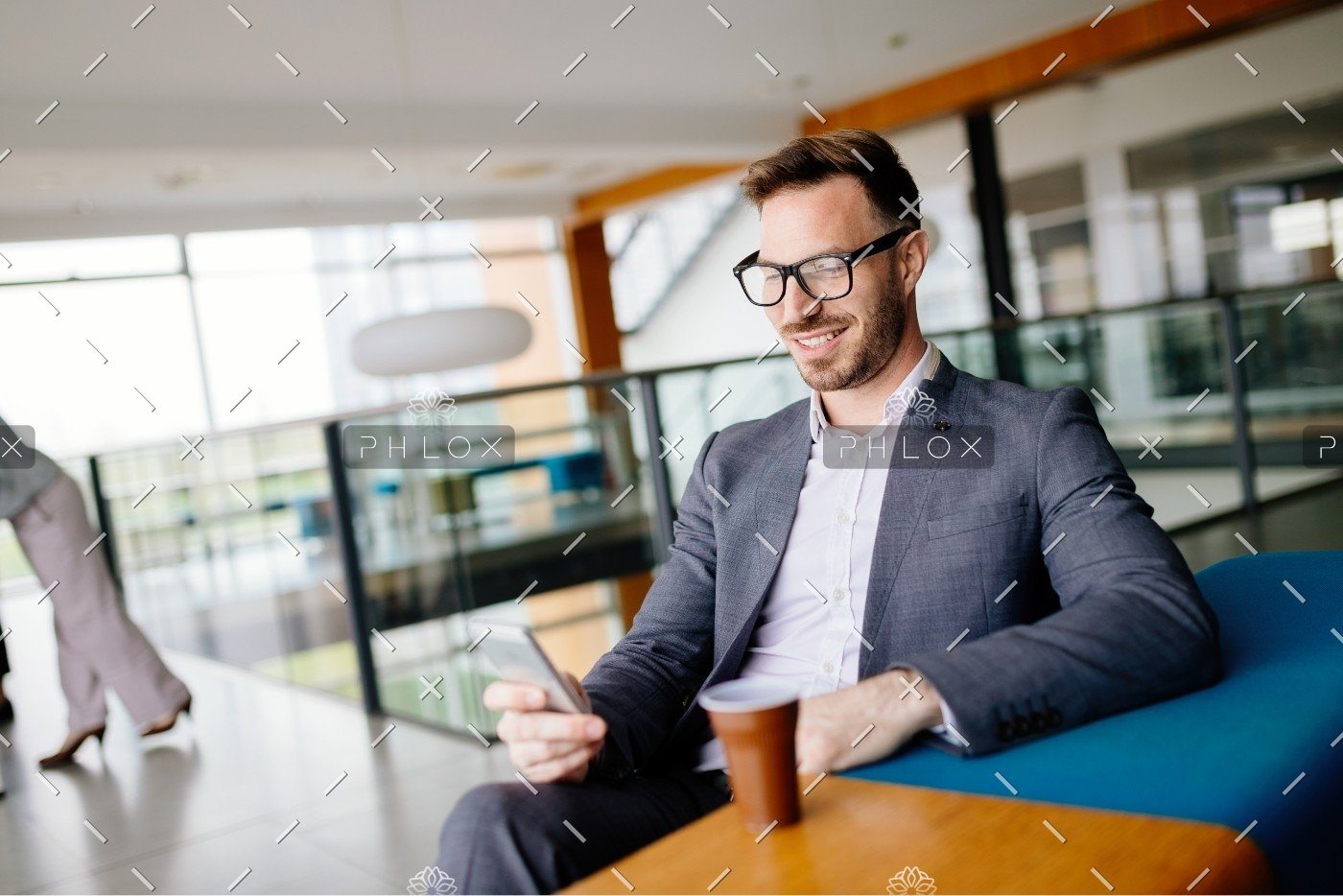 demo-attachment-2706-businessman-taking-a-break-with-a-cup-of-coffee-JW4B3DH