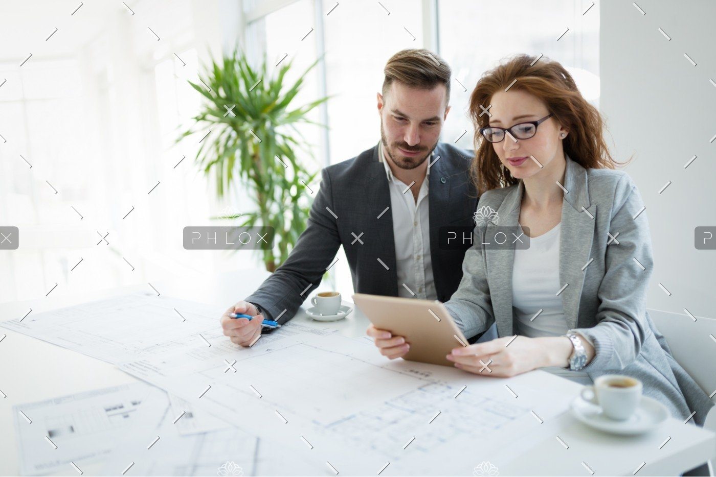 demo-attachment-2723-portrait-of-young-architect-woman-on-meeting-KFZCE3A